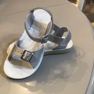 Silver sandals, salt water